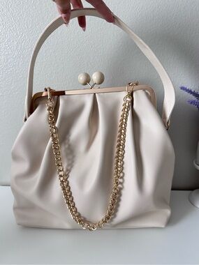 Elegant Cream Clutch Bag with kiss lock closure and Gold Chain